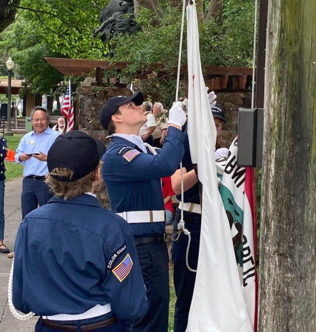 SSS Chaser crew hoisting California State flag