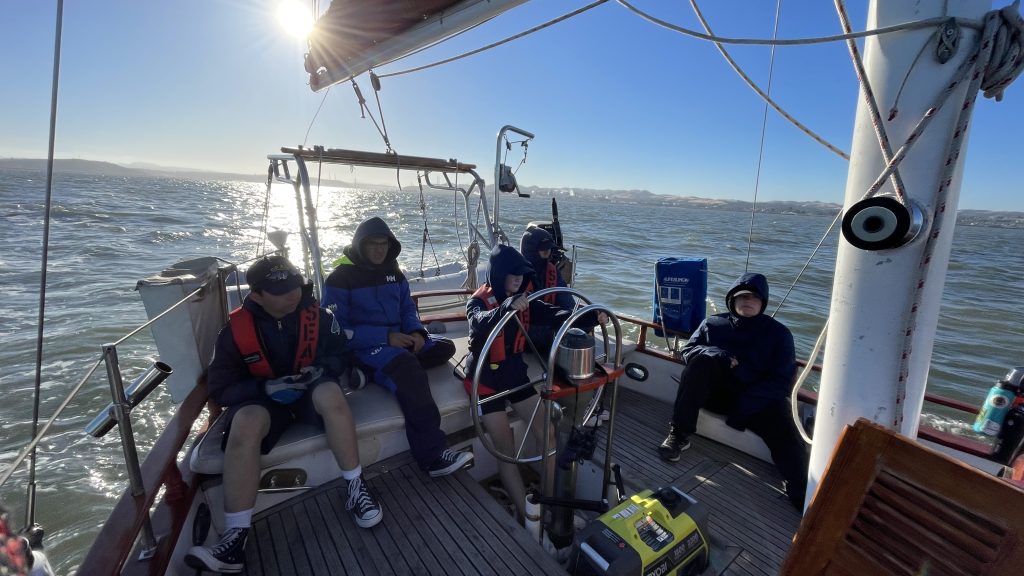 SEAL scouts on helm with sun