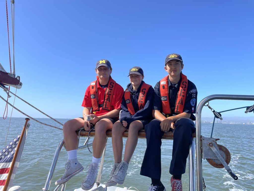 SEAL-scouts-sitting-on-stern-of-boat