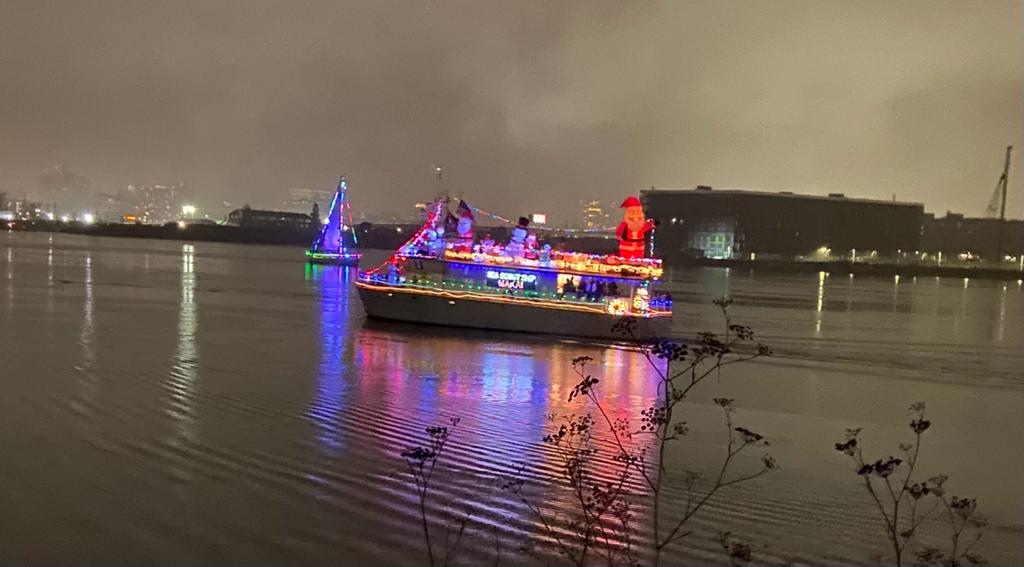 Makai vessel lit up with holiday lights for the boat parade