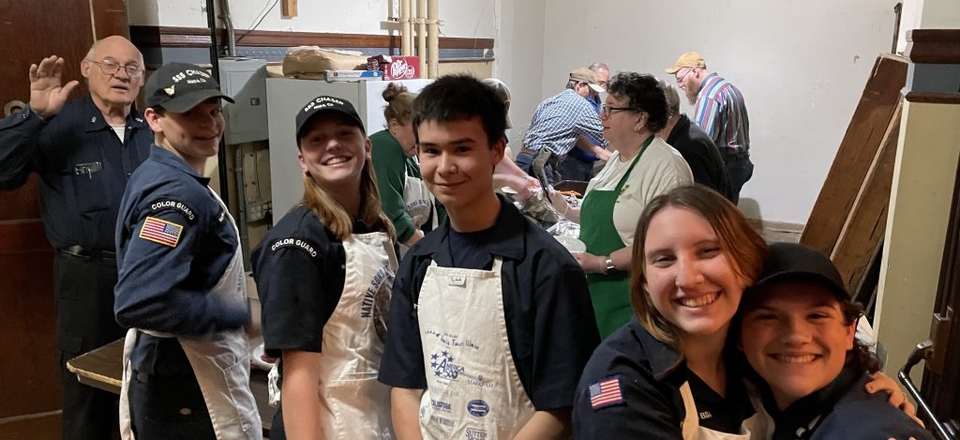 Group picture of Chaser scouts serving at St. Patrick's Day dinner