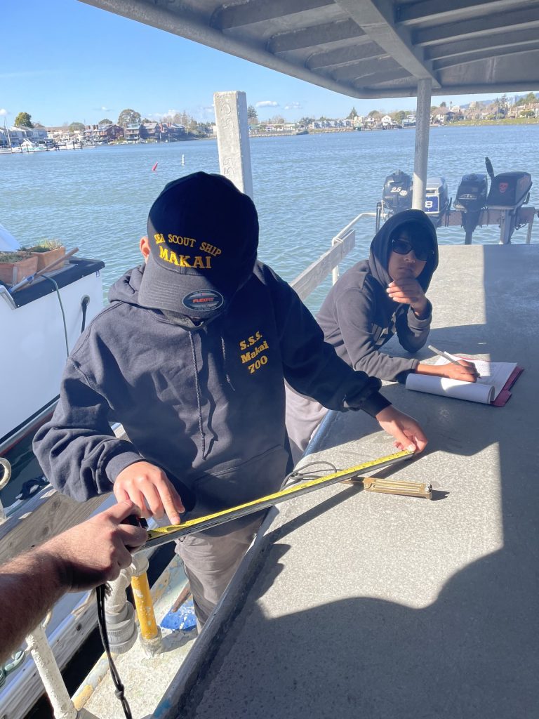 Makai scouts taking measurements